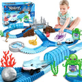 Shark Track Car ocean adventure playset with blue underwater track, shark car, sea creatures, bridges, and 183‑piece kids toy set shown in use by a child.