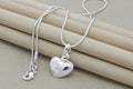 925 sterling silver small heart pendant necklace on snake chain, front view
