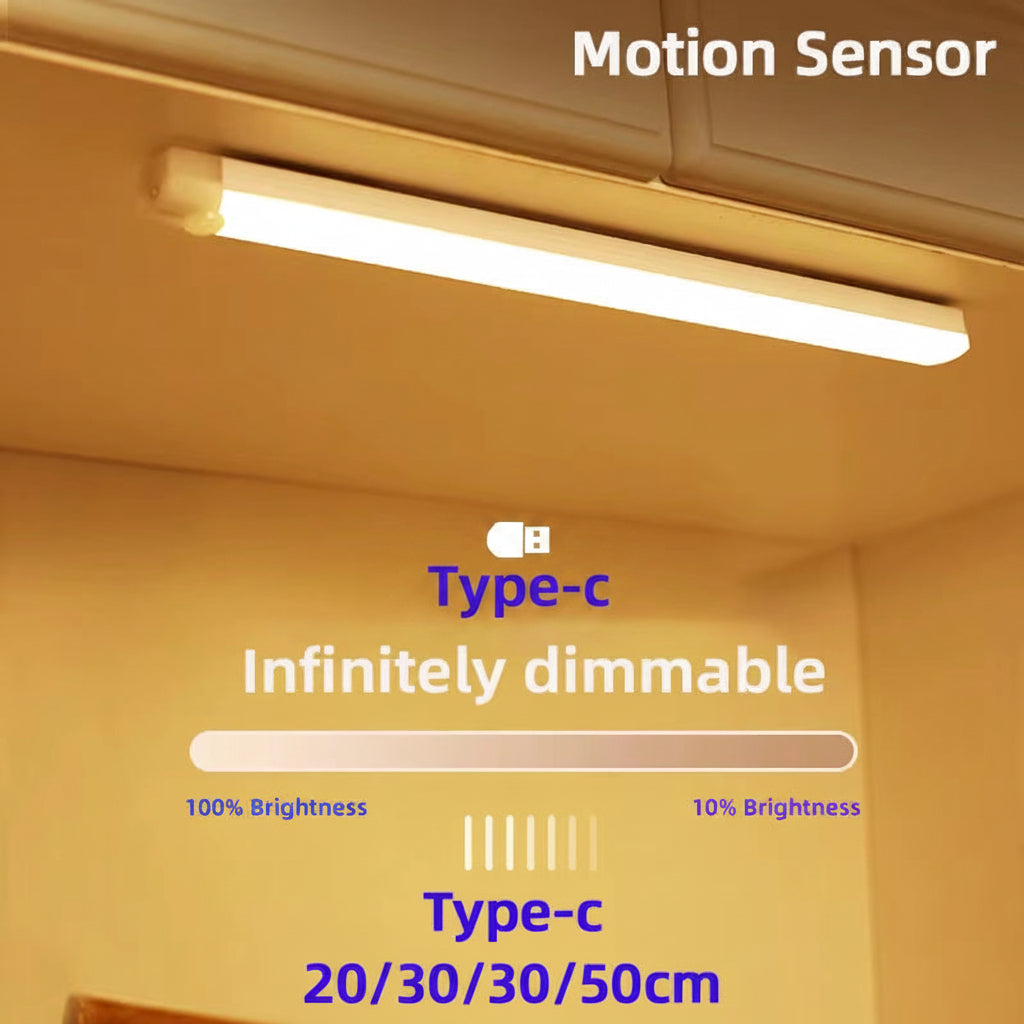 LED strip light mounted under a kitchen cabinet emitting warm white light, labelled Motion Sensor, Infinitely Dimmable, Type-C, available in 20/30/50cm
