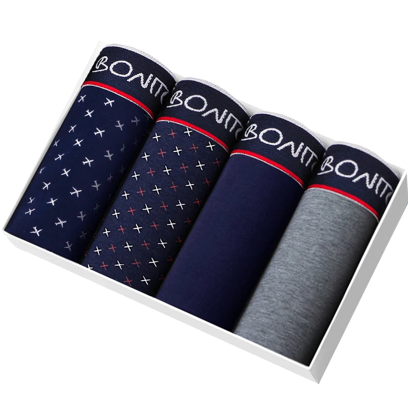 Set of four BONAS men’s boxer briefs in navy, grey, and dark blue neatly folded