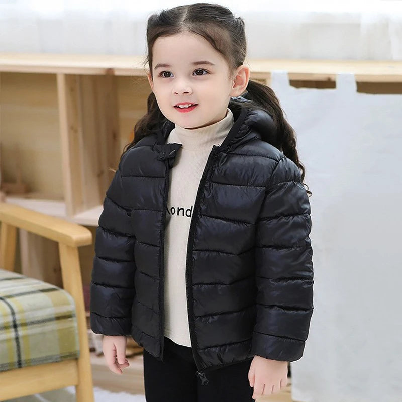 Child wearing lightweight puffer jacket outdoors