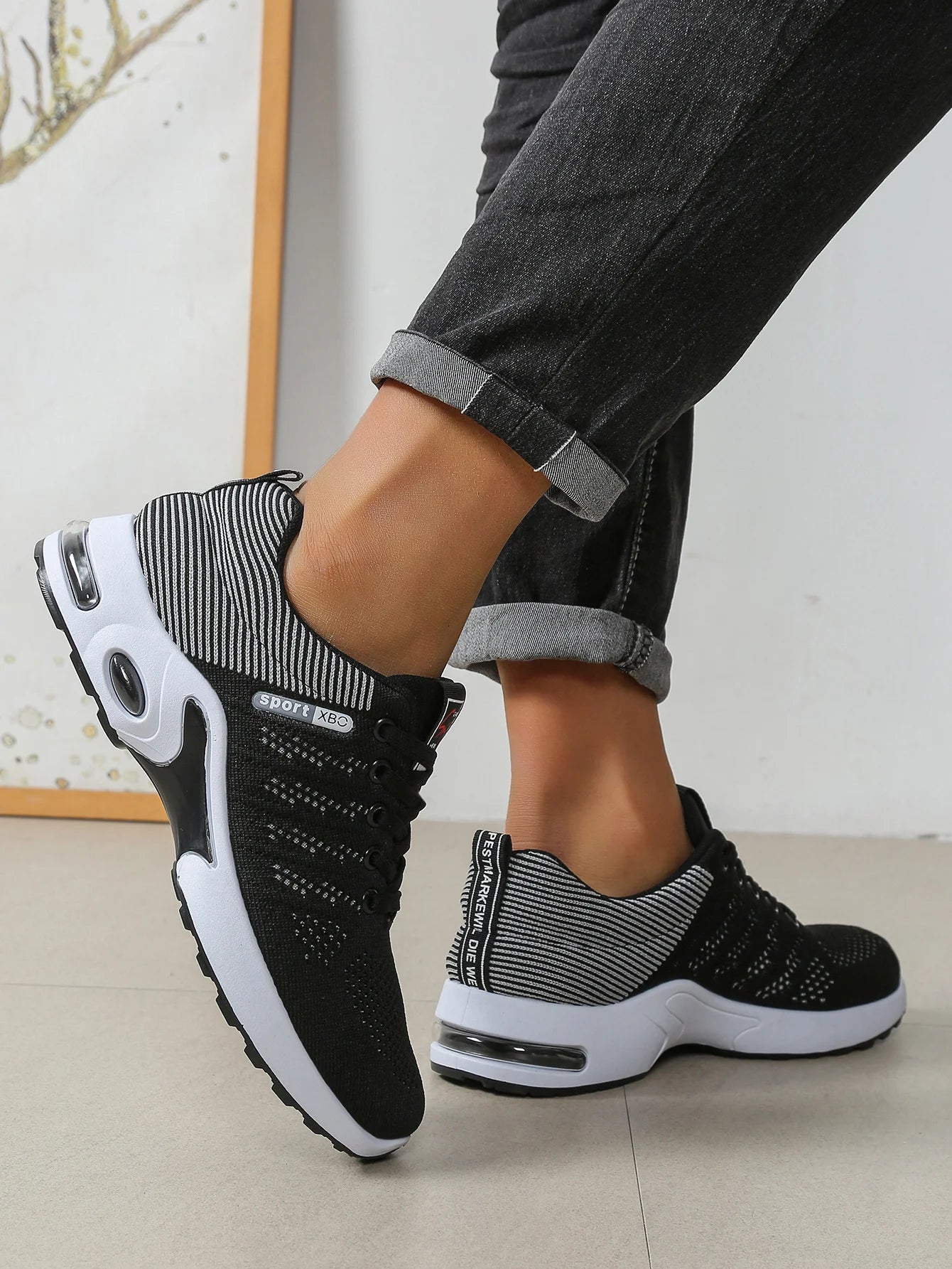 Men's black air cushion sneakers front view – breathable knit upper and white sole