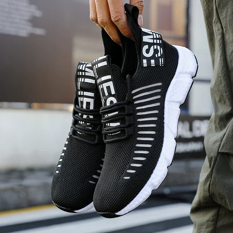 Men's black mesh sneakers side view – flexible outsole and breathable upper detail