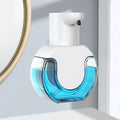 Touchless automatic foam soap dispenser in white on bathroom countertop